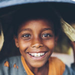 Intrepid Travel-ethiopia_lake ziway_ happy-child-head-carry