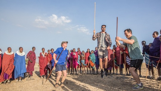 Lonely Planet Experiences_Intrepid Travel-tanzania_cycling_mkuru_travellers-jumping-with-masai_c